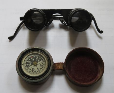LEATHER CASED POCKET COMPASS AND PAIR OF MAGNIFYING SPECTACLES 