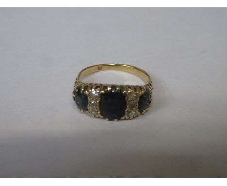 YELLOW, METAL DRESS RING SET WITH THREE SAPPHIRES AND SIX SMALL DIAMONDS 