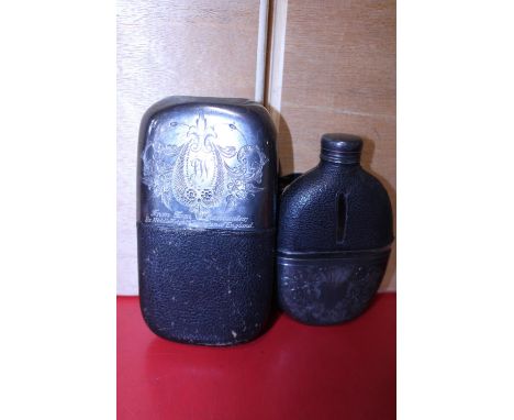 Two antique silver plated hip flasks, one with and inscription that reads: From Tom Lancaster former Middleweight Champion of