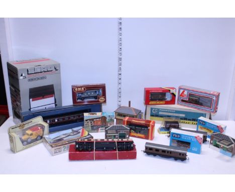 A box full of model railway related items 