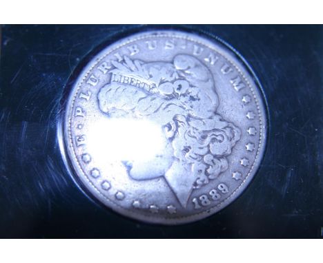 An 1889 American silver dollar 