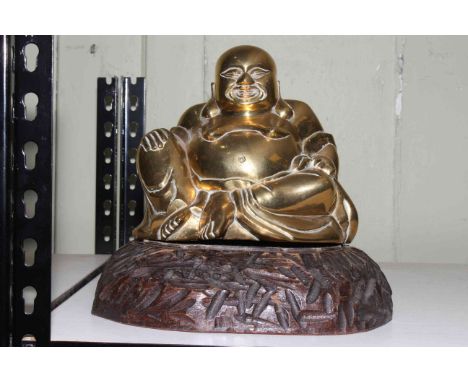 Brass model of a seated Buddha on wood plinth.