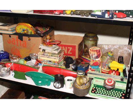 Collection of various toys including pond yachts, Mettoy typewriter, sewing machine, spinning tops, books, etc.