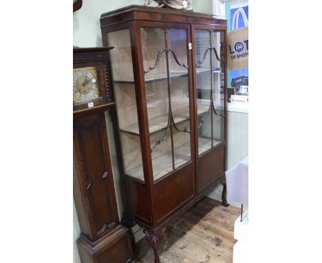 Early 20th Century mahogany Chippendale style two door vitrine on ball and claw legs, 183cm by 105cm by 33cm.