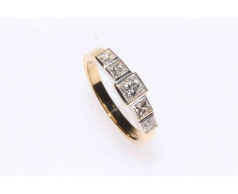 Diamond five stone 18 carat gold ring, having five graduated square cut diamonds, size N.