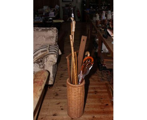 Wicker work stick stand and walking sticks.