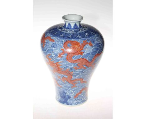 Large Chinese red dragon vase with continuous decoration on sea scroll ground, 34cm, blue mark to base.