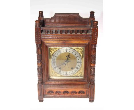 Victorian walnut mantel clock with brass dial, 40cm high.