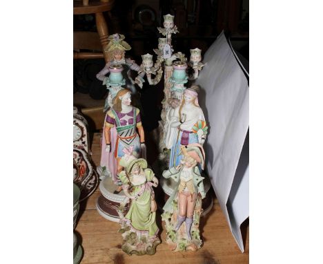 Two pairs and single bisque figures, pair of Continental porcelain woman and cherub candle holders, and Continental three bra