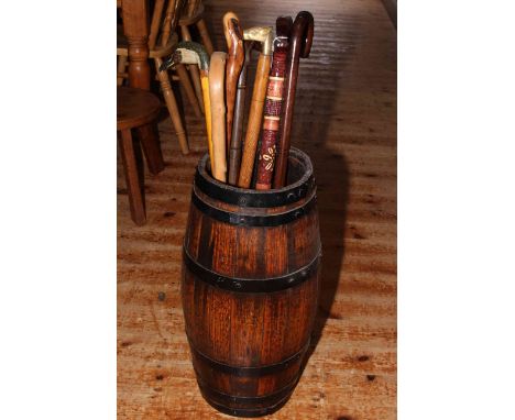 Walking sticks and a barrel stick stand.
