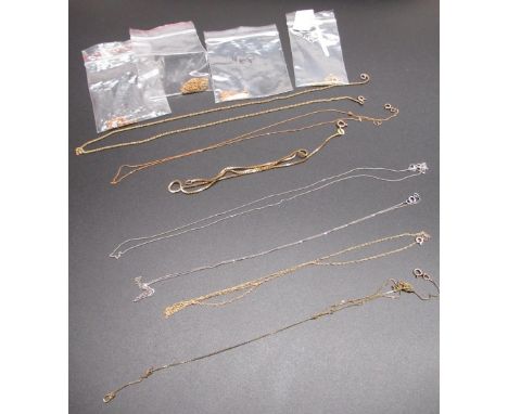 Collection of nine 9ct yellow gold thin chain necklaces of various lengths, gross 9.4g, and a 18ct white gold thin chain neck