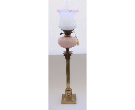 Early C20th brass Corinthian column oil lamp on stepped base with moulded pink opaline glass reservoir and frosted glass shad