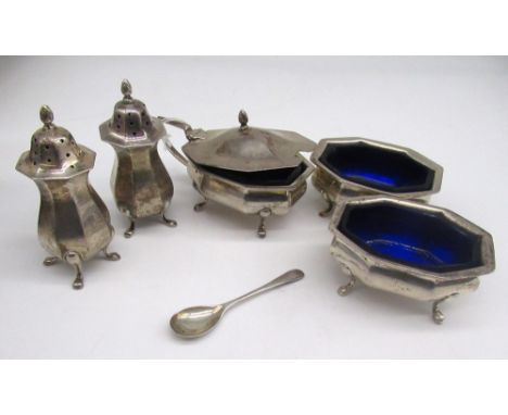 Geo.V hallmarked silver five piece cruet set, including mustard pot and salts with blue glass liners and a pair of casters by