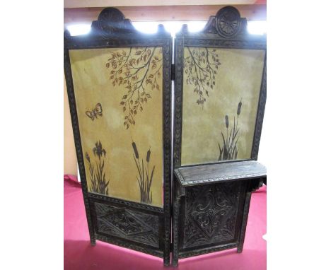 C20th carved oak single fold fire screen, twin carved and painted parchment panels, W74cm H100cm 