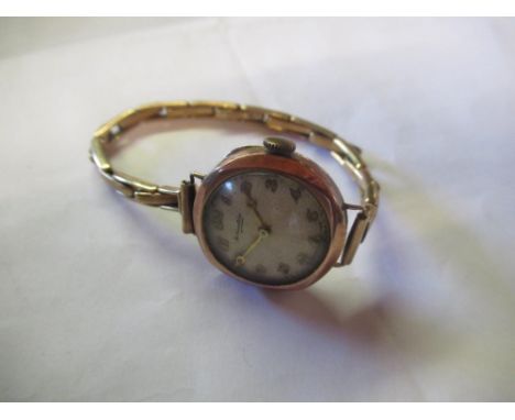 Retailed by Thomas Russell &amp; Son C20th ladies 9ct rose gold cased hand wound wristwatch, signed silvered Arabic dial with