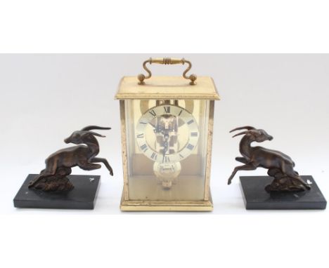 Pair of 1930s bronzed studies of leaping antelope formerly from a clock garniture together with a Acctim carriage type clock 