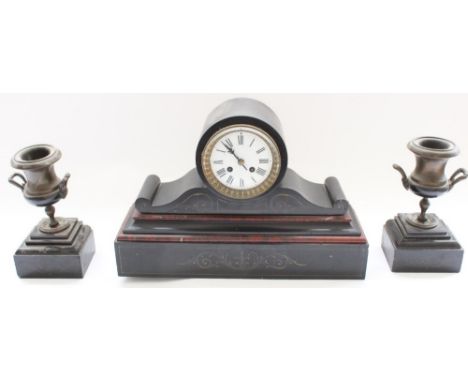 Late C19th French slate rouge marble drum head mantel clock together with associated two piece urn garniture, clock with inci