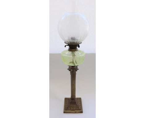 Early C20th brass corinthian column oil lamp with green vaseline glass reservoir, later frosted shade and funnel, total H83cm