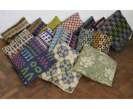 A collection of fourteen knitted wool and tapestry cushions, and a cushion with Liberty style fabric (14)
