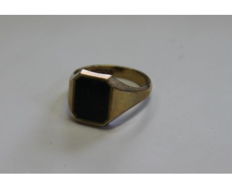 A 9ct yellow gold bloodstone set, signet ring, 'C.G&S' Birmingham, with central canted rectangular panel, weight 6.6gms