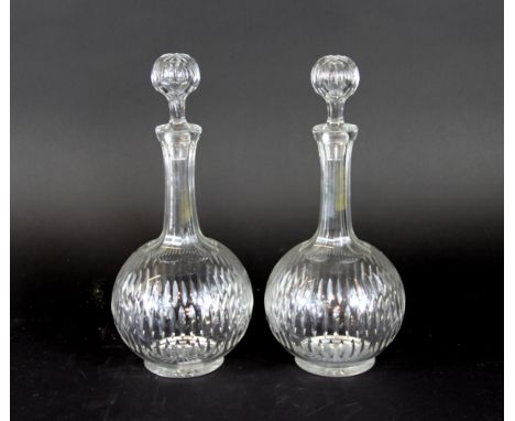 A pair of 19th century cut glass globe and shaft decanters and stoppers, with star cut bases, 30cm