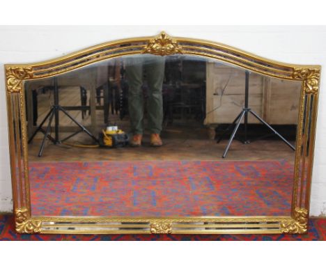 A modern gilt over mantel mirror, with bevelled plate, 83 x 94cm; and an Adam design mirror, 82 x 96cm (2)