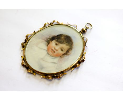 An oval portrait miniature, watercolour on ivory of a young child, early 20th century, glazed, within yellow metal scroll sur