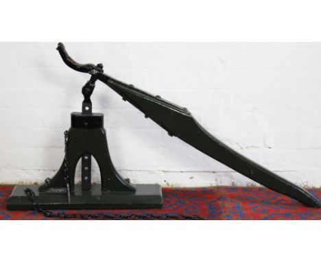 A green painted and cast iron carriage jack, originally used at Bertram Mills Circus in the 1930's on The Old Berkeley Commod
