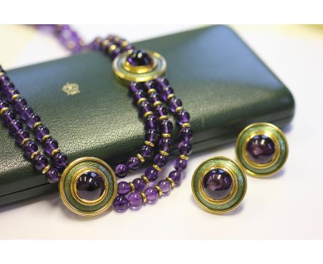 An amethyst bead, gold and enamelled necklace by de Vroomen, retailed by Boodle and Dunthorne, designed as a two strand ameth