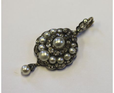 A Victorian untested pearl and diamond brooch/pendant, designed as a central pearl surrounded by a border of mine cut diamond