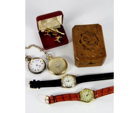 A carved soft wood watch stand, the cover carved with a bird in flight, along with an open face fob watch and chain, a Woodfo