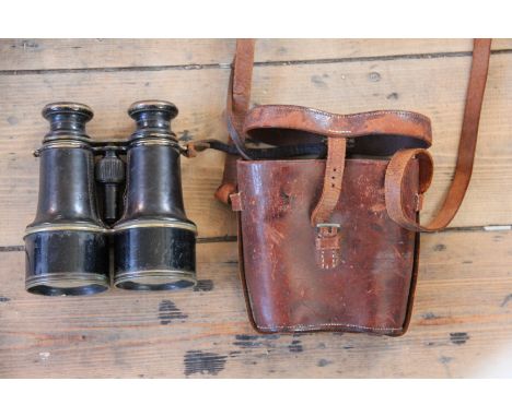 A pair of late Victorian military issue binoculars, one barrel engraved S.3, the other 11089 above a military arrow, the leat