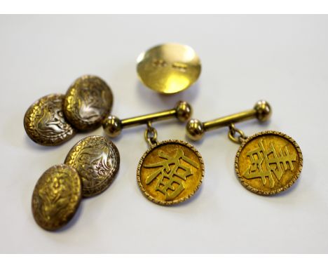 An 18ct yellow gold shirt weight 4.4gms, a pair of Chinese cufflinks with designed as a circular panel with Chinese character