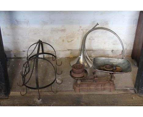 A set of cast iron kitchen scales, the weight tray stamped 'R. Leighton'; a selection of weights; a saucepan rack and a horn 