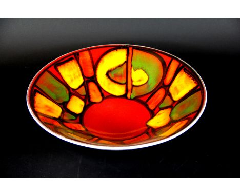 A Poole pottery Delphis ware bowl, shape number 58, decorated in bright red, orange, yellow and green glazes, artists monogra
