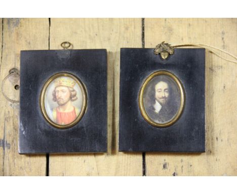 Two ebonised portrait miniature frames with gilt oval apertures, easel back, one with acorn detail, 12.5cm high (2) 