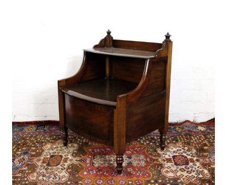 A late George III mahogany bow front commode, on turned legs, 62cm x 54cm x 46cm