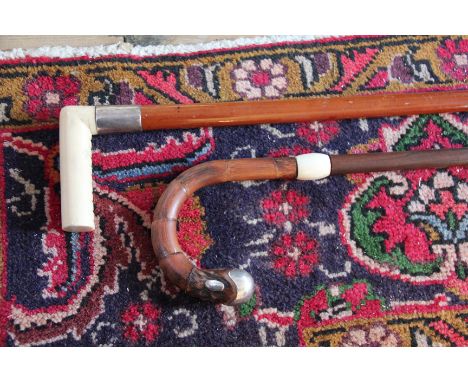 A Victorian Malacca walking stick, with ivory handle and silver collar engraved Fras Berry; and a rosewood and bamboo walking