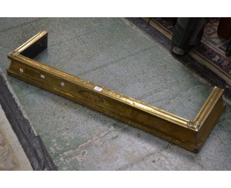 An Arts and crafts brass fender 114 cm wide