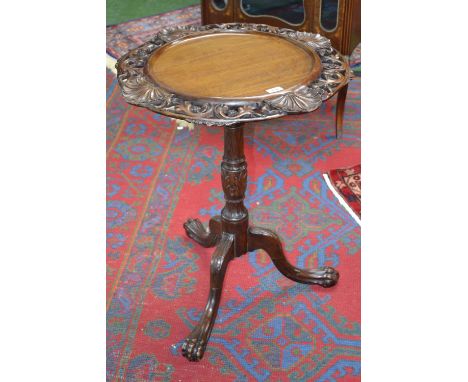 A 19th century Anglo-Indian hardwood tripod occasional table, dished tilting top, the shaped border pierced and carved with l