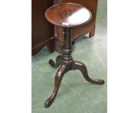 A George III mahogany kettle stand, circular dished top, arrow decoration to the border, turned column, cabriole supports, pa