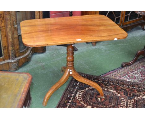 A Victorian mahogany rounded rectangular tripod occasional table, turned column, downswept legs, 72cm high, 92cm wide
