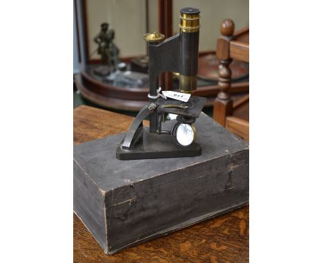 A blued and lacquered brass monocular microscope, by R & J Beck, London, push/pull adjustment, sub-stage condenser, convex/pl