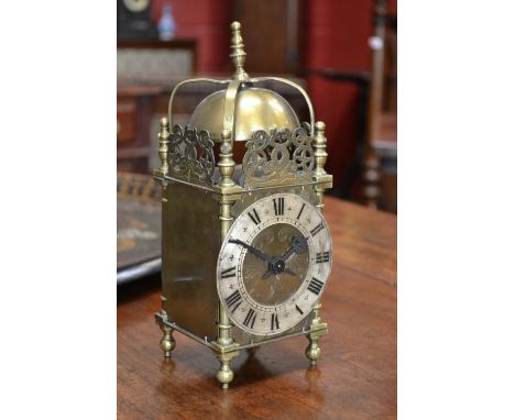 An early 20th century brass lantern clock mantel timepiece, of small proportions and in the 17th century taste, 10cm silvered