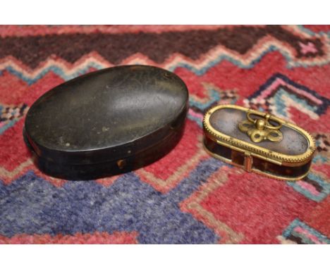 A French gilt brass mounted tortoiseshell oval snuff box, hinged cover with loose ring finial, 6.5cm wide, c.1900; another, l