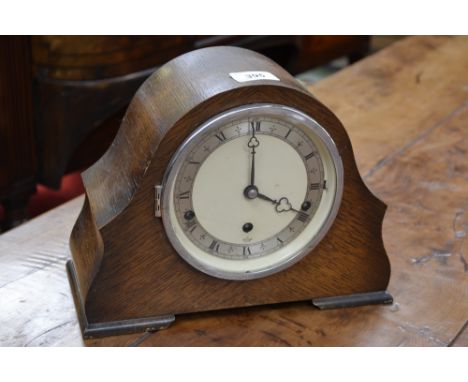 An oak Elliot mantel clock, Westminster chime, key and pendulum