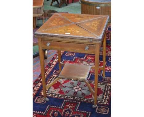 An Edwardian Sheraton Revival satinwood crossbanded mahogany and marquetry envelope card table, quadripartite folding top inl