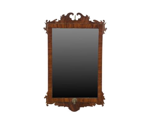 A GEORGE I STYLE WALNUT FRAME WALL MIRROR, of upright rectangular form, with carved scroll frames, surmounted by broken swan 