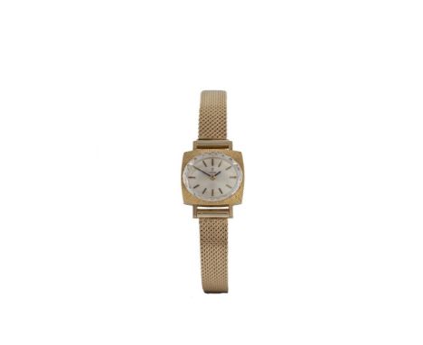 AN 18 CARAT GOLD WRISTWATCH BY TUDOR, the oval silvered sunburst dial with baton indexes signed Tudor, to a textured square b