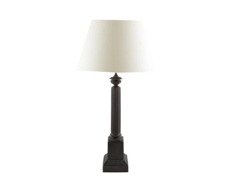 A BRONZED METAL COLUMN TABLE LAMP, the reeded pillar raised on a square platform base, with silk shade. 59cm high